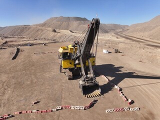 Electric mining shovel, Mining equipment, Large-capacity shovel, Mining operations, Mining industry, Chile, Truck loading shovel, Aerial mining view, Mining machinery assembly, Open-pit mining, Copper