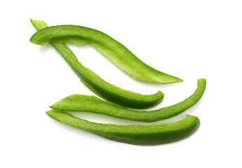 Sliced green bell pepper in a bowl on white background