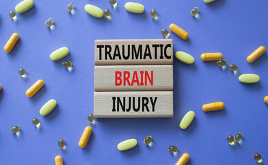 Traumatic Brain Injury symbol. Concept words Traumatic Brain Injury on wooden blocks. Beautiful...