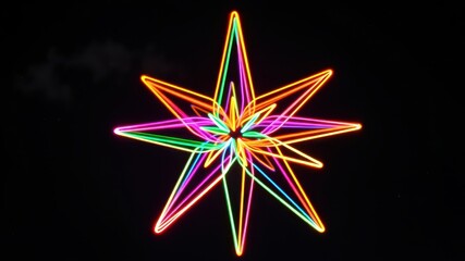 A vibrant, luminous starburst of neon light, creating an abstract and dazzling display against a dark background.