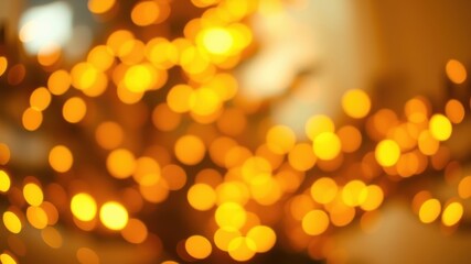 Obraz premium A bokeh background of warm, glowing orbs, creating an abstract pattern of light and shadow.
