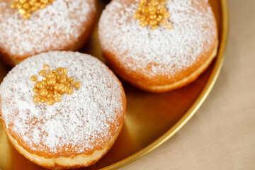 Hanukkah holiday card with sweet doughnuts sufganiyot (traditional donuts) Selective focus