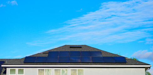 Solar panel on a house roof; Green energy from sun	
