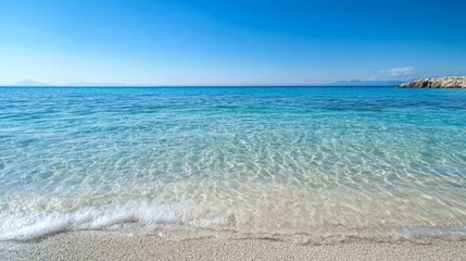 Fototapeta premium Tranquil Ocean Serenity, a peaceful coastal scene featuring gentle waves caressing the sandy shore beneath a bright blue sky, inviting a sense of calm and relaxation.