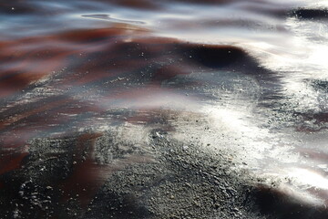 Abstract Image of Polluted Water Surface with Oily Patterns