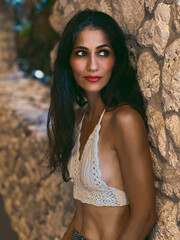 Naklejka premium Attractive woman enjoying a hot day at the park wearing a crop top