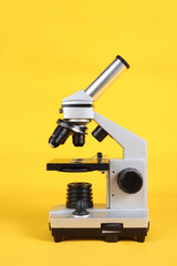 A microscope on profile isolated on a yellow background