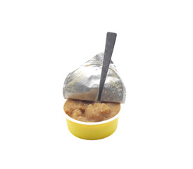 Small plastic pot of baby food with open lid and spoon on transparent background
