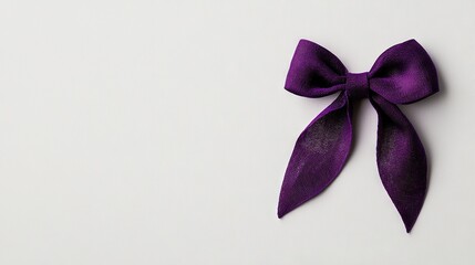   A close-up of a purple ribbon on a white background with a black bow tied at the end