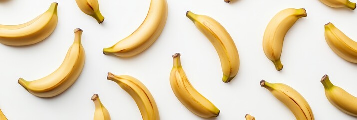 Ripe Yellow Bananas Isolated on White Background - Fresh, vibrant yellow bananas arranged on a white backdrop.  Healthy, tropical fruit, perfect for breakfast, snacks, or smoothies. Represents vitalit