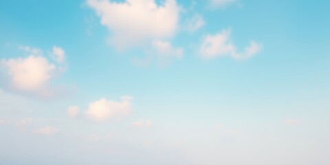 Obraz premium Soft, Wispy Clouds Drifting Across a Pale Blue Sky, Creating a Serene and Tranquil Atmosphere