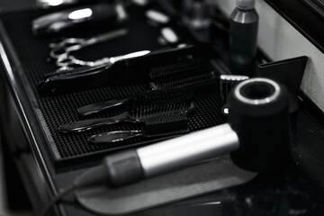 Tools arranged neatly on a salon counter ready for hairstyling services