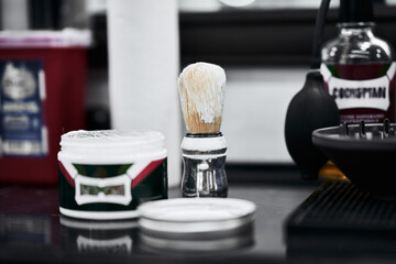 Traditional shaving tools on a countertop in a barber shop