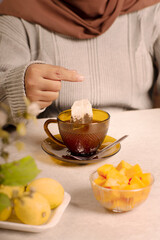 a glass of warm lemon tea