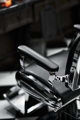 Classic barber chair in a vintage barbershop with black and white decor