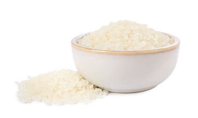Raw rice in bowl isolated on white