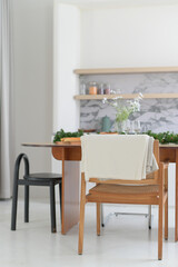 Minimalist dining area with wooden furniture and decor
