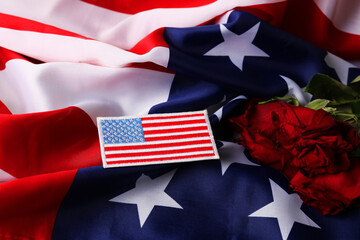 Veterans day. USA army patch, American flag and roses, closeup