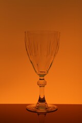 One empty glass on table, color tone effect