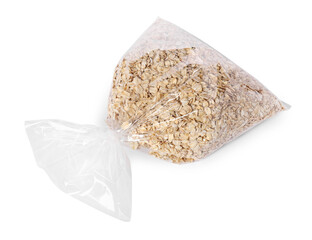 Plastic bag with oat flakes isolated on white, top view