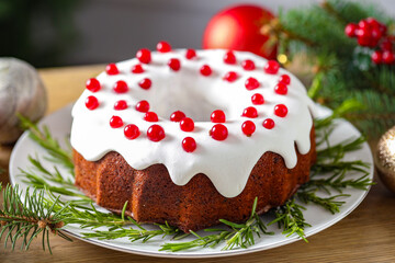 Traditional classic Christmas cake and decor on wooden table, closeup