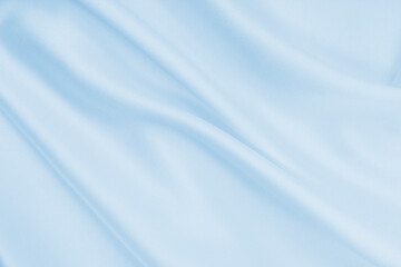 Smooth elegant blue silk or satin luxury cloth texture as abstract background. Luxurious background design