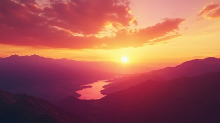 Obraz premium Mountain sunset vista, breathtaking view from a high peak, vibrant orange and pink hues blending in the sky, serene atmosphere, nature's beauty on display