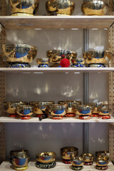 Shelf with Tibetan harmonic bowls and their pad underneath