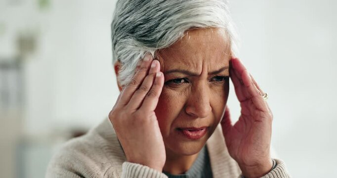 Stress, migraine and mature woman in home with flu, cold or allergies with symptoms for fatigue. Burnout, tired and female person with headache for sinus congestion, vertigo or discomfort in house.