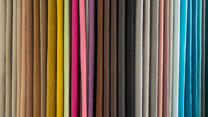 Obraz premium Colorful samples of upholstery fabric for home sofa. Furniture manufacturing.
