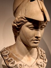 Close up of an ancient Greek marble bust of goddess Athena with a Corinthian helmet 