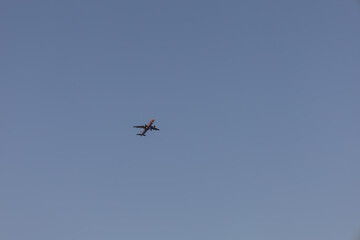 Large airliner in a blue cloudless sky