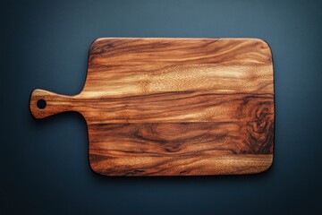Rustic wooden cutting board with handle, overhead view.