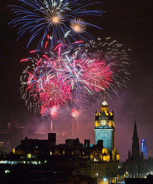 Fireworks exploding over Edinburgh Castle at night, Edinburgh, Scotland, UK