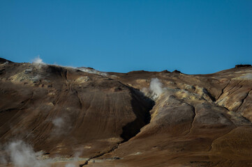 A powerful eruption from a geyser at Geyser Park in Iceland, showcasing geothermal energy, ecology,