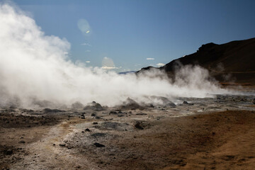 A powerful eruption from a geyser at Geyser Park in Iceland, showcasing geothermal energy, ecology,