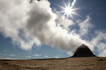 A powerful eruption from a geyser at Geyser Park in Iceland, showcasing geothermal energy, ecology,