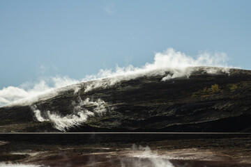 A powerful eruption from a geyser at Geyser Park in Iceland, showcasing geothermal energy, ecology,