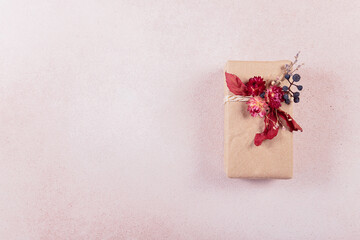 Autumn vibes, Thanksgiving day present, seasonal sale concept. Handcrafted gift box with autumn dried leaves, flowers and berries. Fall composition