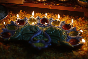 This image captures the essence of Diwali, showcasing traditional clay diyas (oil lamps) beautifully lit, symbolizing the triumph of light over darkness. 
