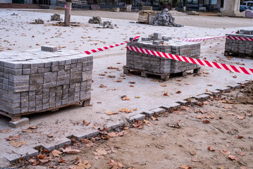 Pavement Concrete Tiles at Pallet Construction Site. Urban construction, paving slabs