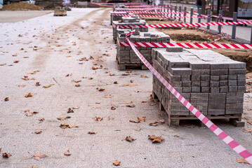 Pavement Concrete Tiles at Pallet Construction Site. Urban construction, paving slabs