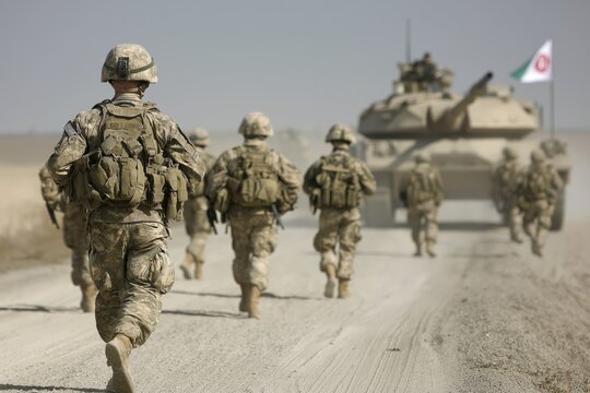 Desert military exercise featuring tanks and soldiers with flags of USA, Iran, and China in background under bright sunlight - Powered by Adobe