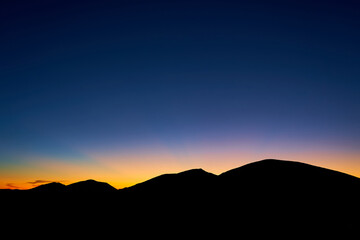 Sunset mountain landscape, breathtaking view in nature. Beautiful mount silhouette, tourism concept