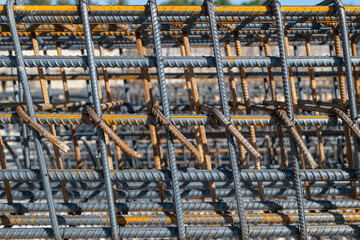 Iron rods tied to be placed in the foundation of a building.