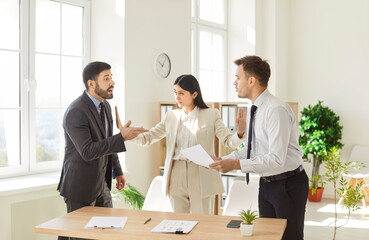 Business team of angry people shouting and arguing during a meeting in an office. The conflict illustrates workplace challenges, fight, teamwork struggles, and high pressure environments.