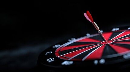 Obraz premium Close-up of a dartboard with a red and black dart in the center. the dartboard is circular in shape and has a black background with white numbers around the edges.