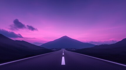 Landscape photograph of a long, straight road that stretches into the distance. the road is in the center of the image, with a mountain in the background.
