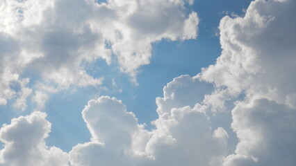 Blue and white sky background with clouds on sunny and cloudy weather. Topics: air space, meteorology, atmosphere