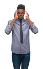 Fototapeta premium Young african american business man over isolated background with hand on head for pain in head because stress. Suffering migraine.
